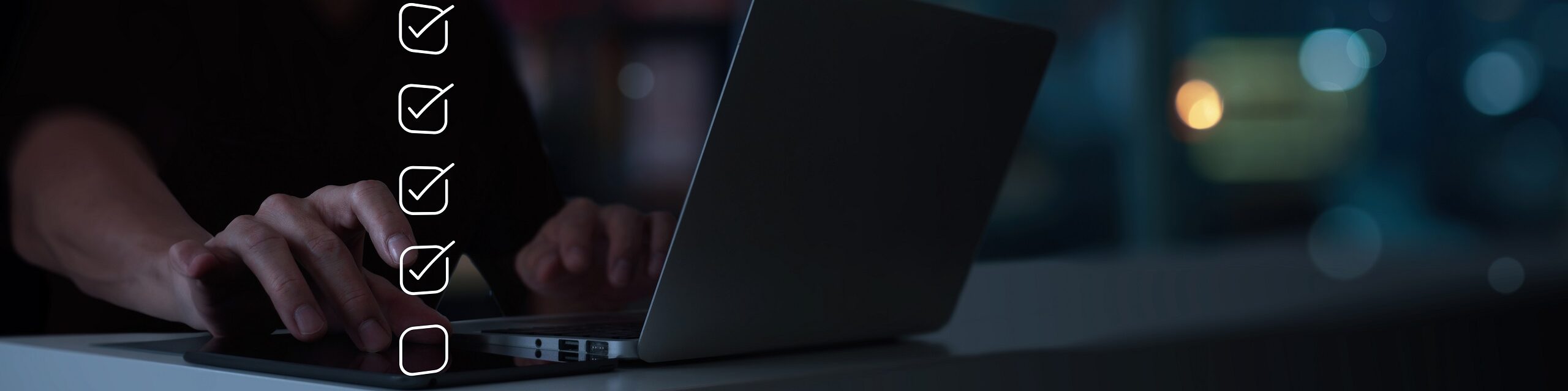 A person documenting standard work on their computer.
