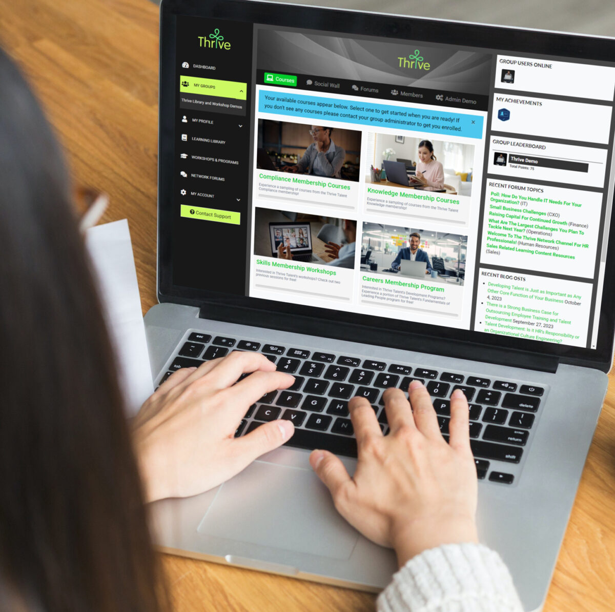 Person browsing online courses on a laptop.